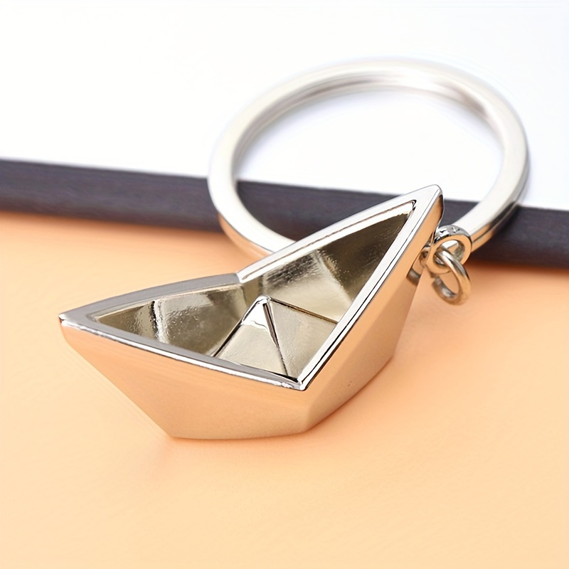 TEMU Un llavero colgante de barco pequeño, diseñado como una decoración creativa para llaves de coche, mochilas y billeteras