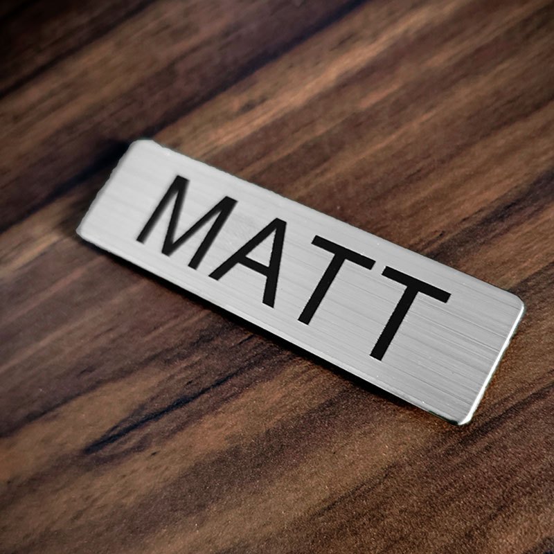 

Custom Name Badge Holder In Brushed Silvery Metal Plate With Black Text Name Icon For Personalized Identification Tag - 70x20mm Non Fading Engrave Technoloy