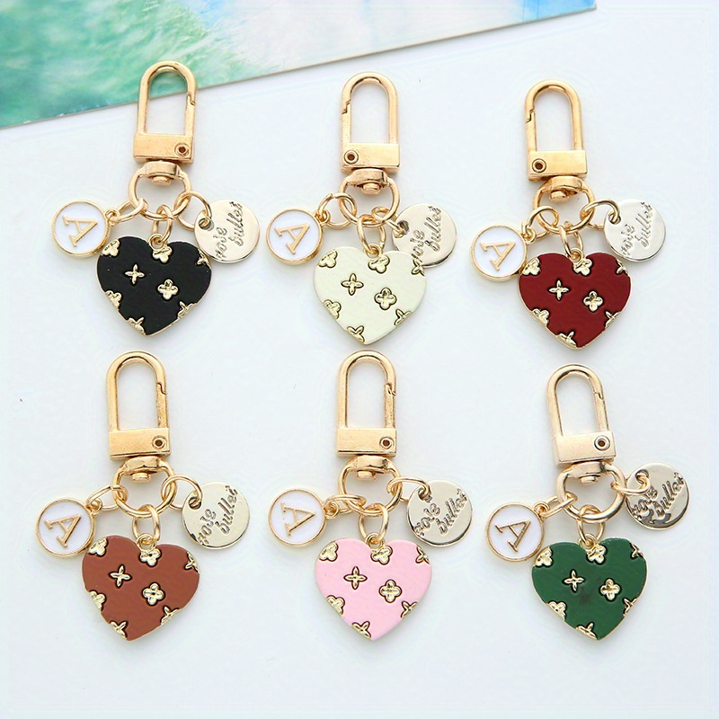 

1pc Heart Keychain Charm, Creative Hollow Floral & Letter Round Tag, Headphone Case & Handbag Decoration Keyring