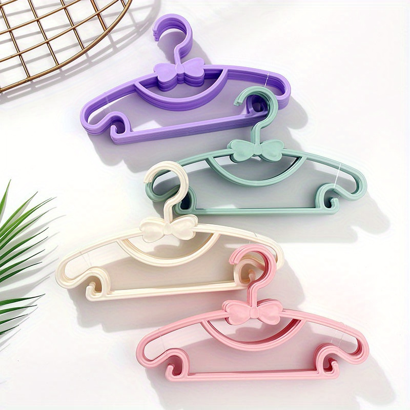 

6pcs/12pcs Small Clothes Hangers, Plastic Hanger With Bow Design, Portable Display Organizer For Small Coats And Clothing, Ideal For Clothing Stores