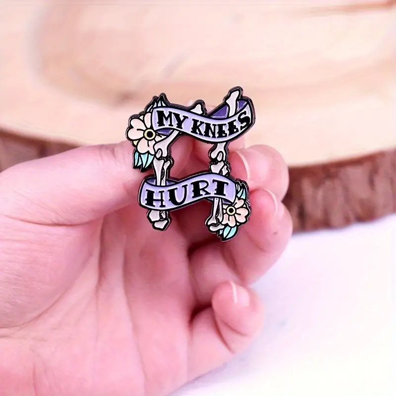 

my Knees Hurt" Enamel Pin, Punk Style Creepy Knee Bone Brooch With Floral Accents, Fashion Accessory For Jackets And Backpacks