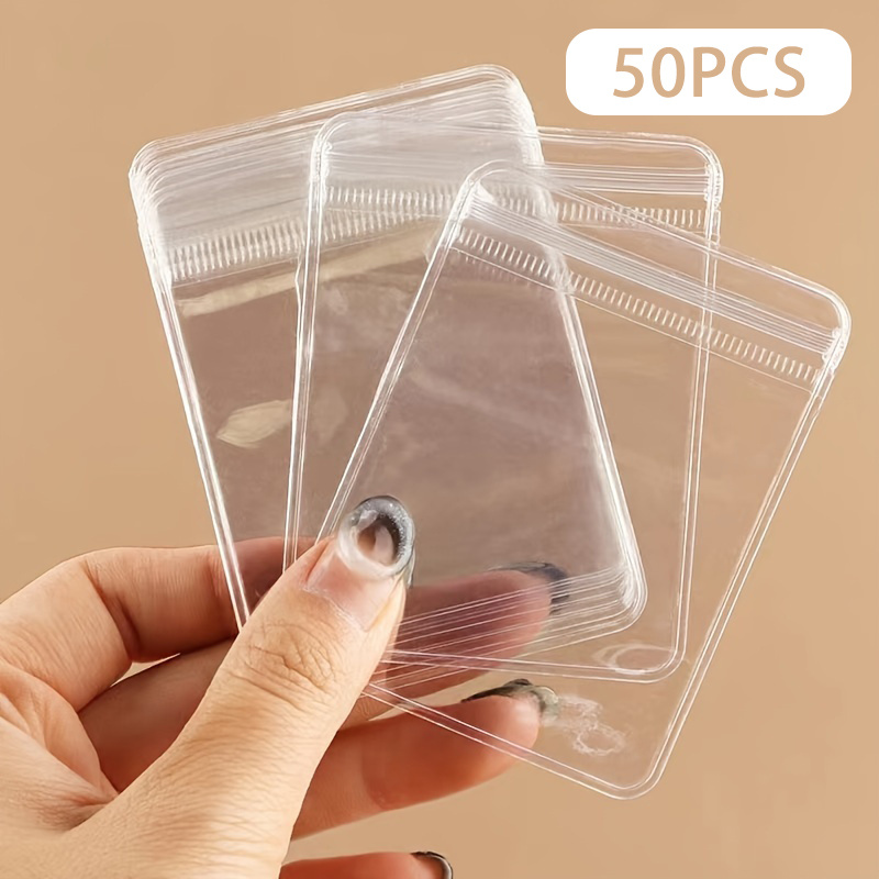 50pcs/100pcs Mini Jewelry Bags - Transparent Zipper Bags For Ring, Earring, Necklace Storage, Portable Waterproof Packaging Bags, Small Commercial Supplies
