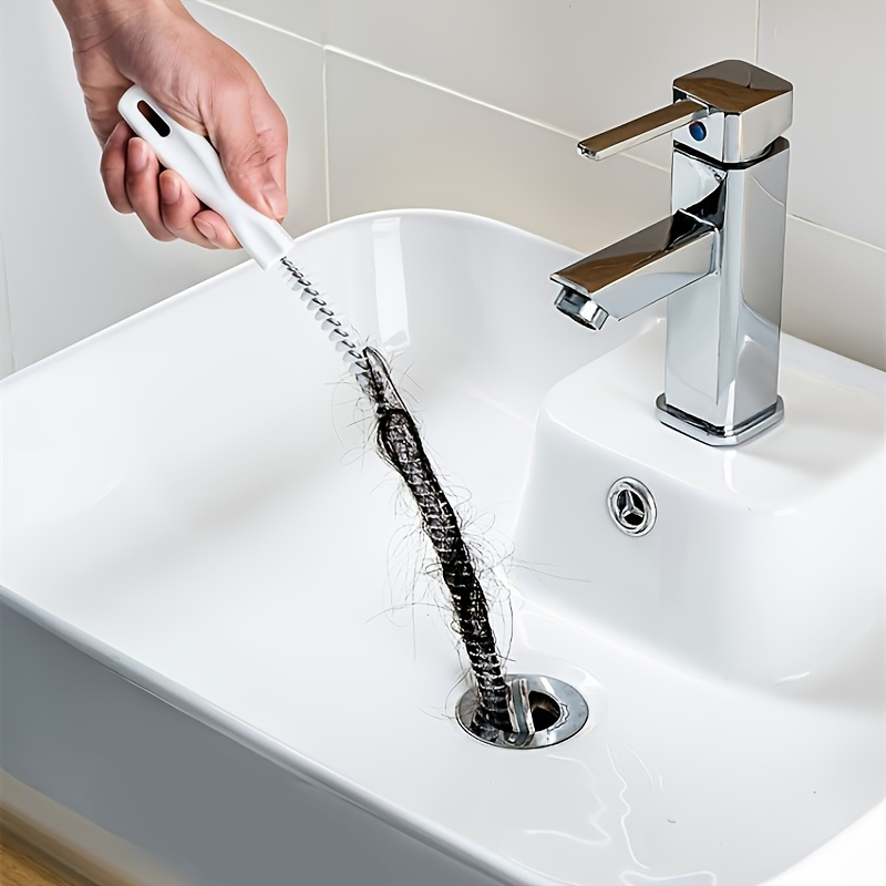 a flexible drain cleaning brush designed for clearing kitchen and bathroom pipes featuring an easy to grip handle reusable socket tool and   for electricity details 3