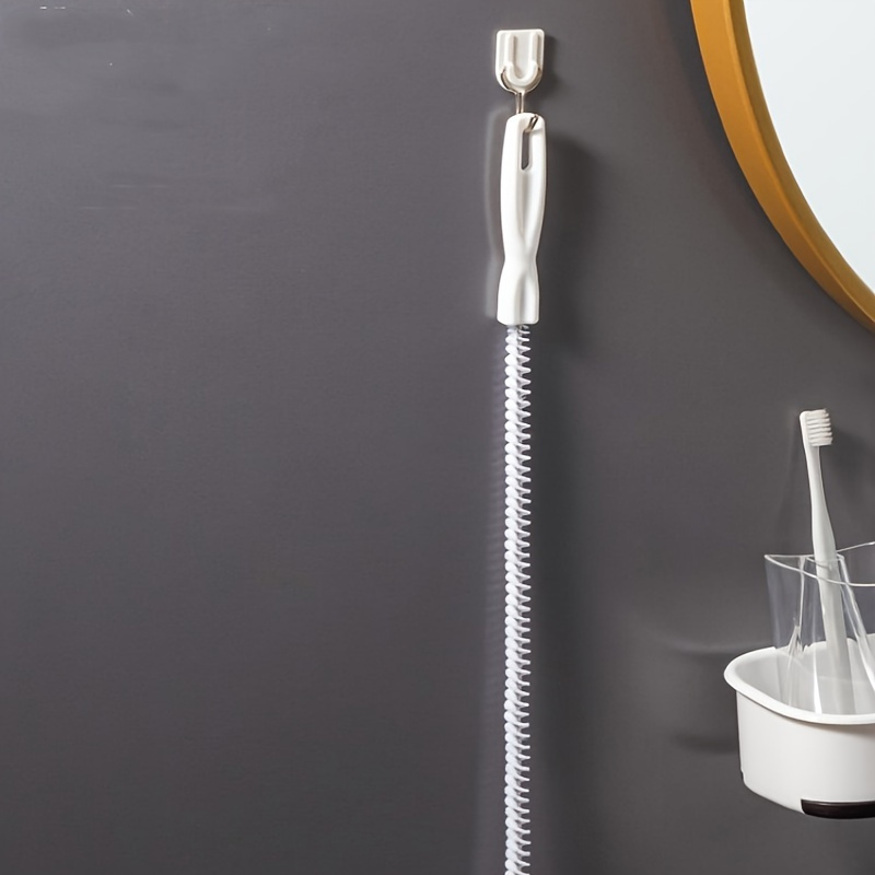 a flexible drain cleaning brush designed for clearing kitchen and bathroom pipes featuring an easy to grip handle reusable socket tool and   for electricity details 6