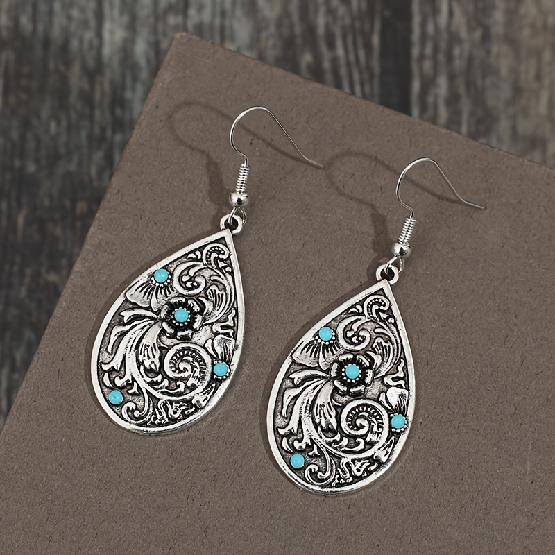 

Enchanting Vintage Turquoise Earrings - Intricately Carved Droplet Shape With Vibrant Flower Pattern - Swinging Dangle For Bohemian Chic Style - Ideal For Vacation & Holiday Adventures