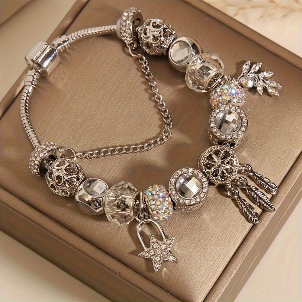 

A Stylish And Luxurious Beaded Silvery Bracelet With And Feather Charms, Charm Bracelet For Beautiful And Elegant Girls.