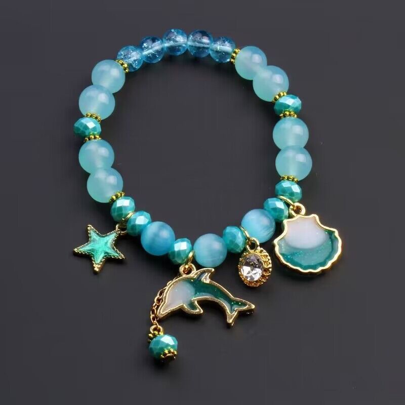 

Delicate Mixed Color Beaded Bracelet With Star And Dolphin Charms - A Beach Vacation