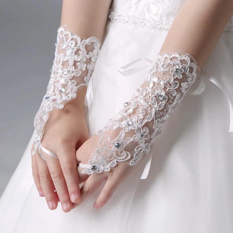 

A Pair Of White Fingerless Wedding Gloves With Lace And Beaded Details For Bridal Wedding Accessories Stage Performance