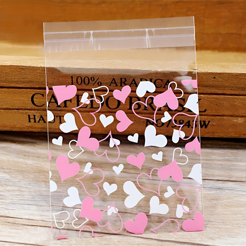 

sachets cadeaux en plastique avec fermeture autocollante, motif cœur transparent pour , les bonbons et les emballages de .