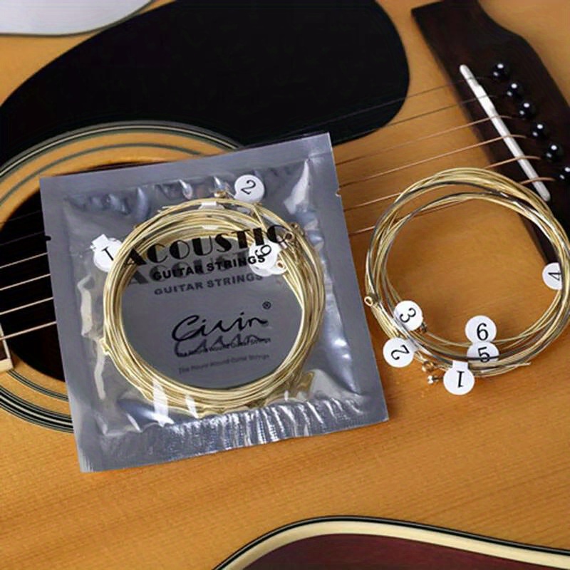 1 Set 6pcs Practice Nickel Plated Steel Guitar Strings for Acoustic Guitars - Golden Coated Roundwound Strings with Polished Finish, Durable & Smooth Playability, Enhanced Tone & Control for Beginners & Advanced Players, Guitar Accessories, Acoustic Guitar Upgrade, Sleek String Design, Nickelplated Strings, Durable String Construction, Studio Practice, Roundwound Strings, Highquality Strings, Acoustic Guitarists