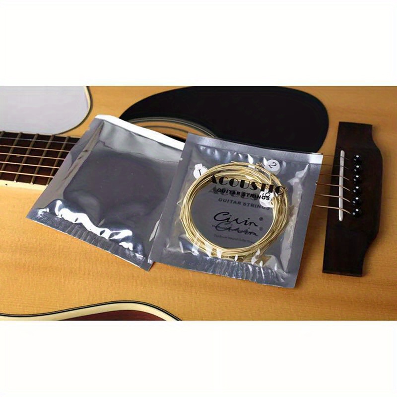 1 Set 6pcs Practice Nickel Plated Steel Guitar Strings for Acoustic Guitars - Golden Coated Roundwound Strings with Polished Finish, Durable & Smooth Playability, Enhanced Tone & Control for Beginners & Advanced Players, Guitar Accessories, Acoustic Guitar Upgrade, Sleek String Design, Nickelplated Strings, Durable String Construction, Studio Practice, Roundwound Strings, Highquality Strings, Acoustic Guitarists