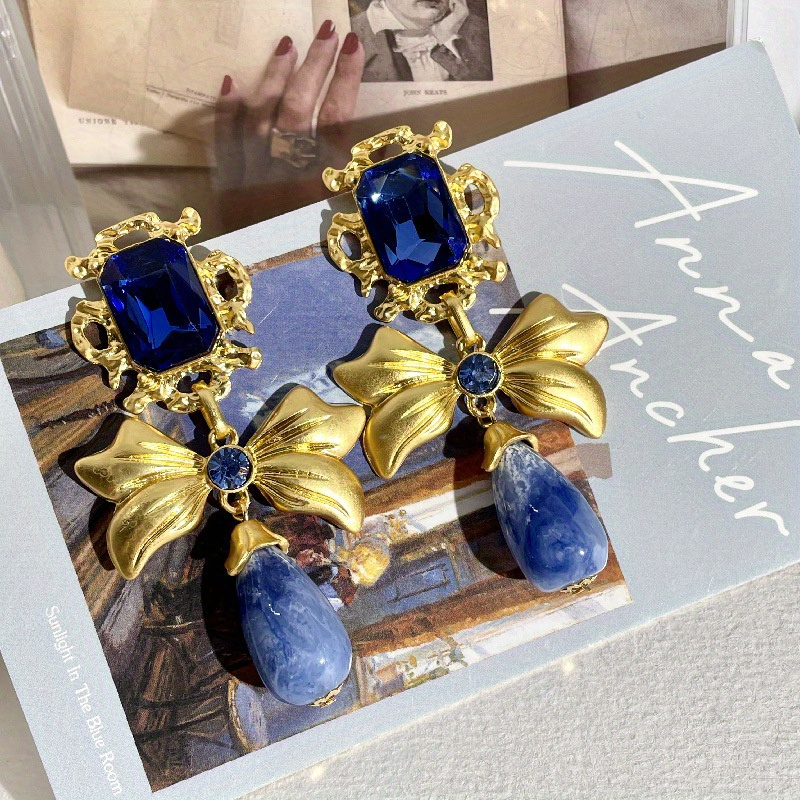 

2pc Exquisite Elegant Bow Classical Fashion Copper Rhinestone Golden Color Blue Pendant Earrings Ladies Gift Banquet