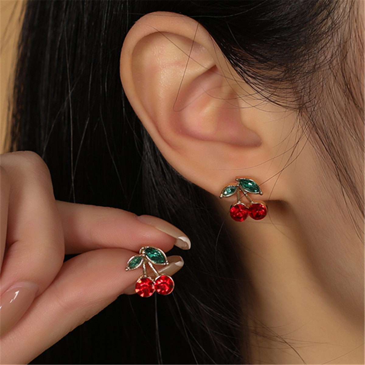 

Trendy And Unique Design Of Red Cherry Earrings With A Touch Of Golden, Exuding A Cute And Sweet Vibe For Fashionable Girls With A Distinctive Taste.