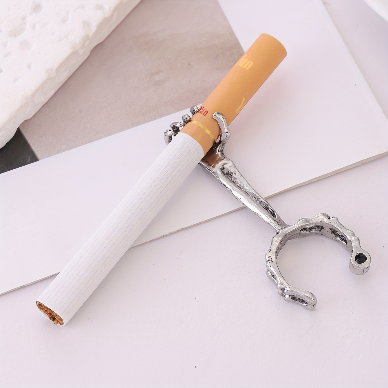 1pc of a bone shaped smoking ring with a skull design on the mouthpiece Product details 1