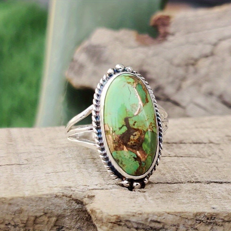 

A Luxurious Oval Green Turquoise Halo Women's Fashion Ring With A Random Main Stone Pattern Is Perfect For Anniversary And Birthday Gifts