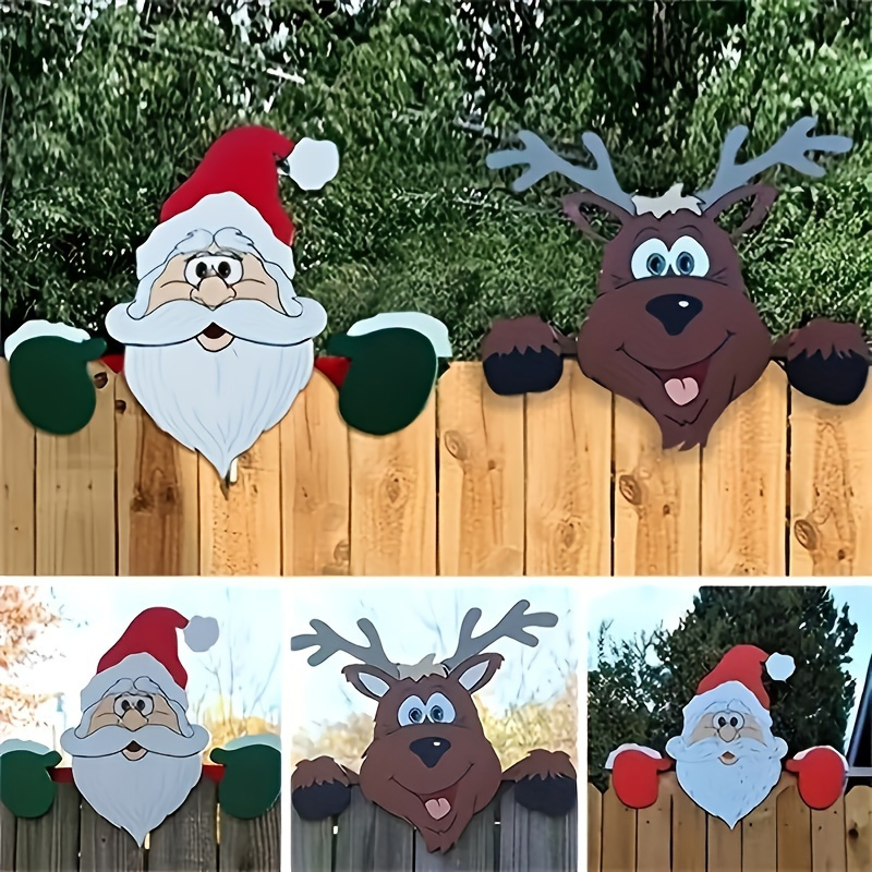 set of 2 christmas fence decorations featuring santa claus and   peeking over   outdoor garden signage and   decor