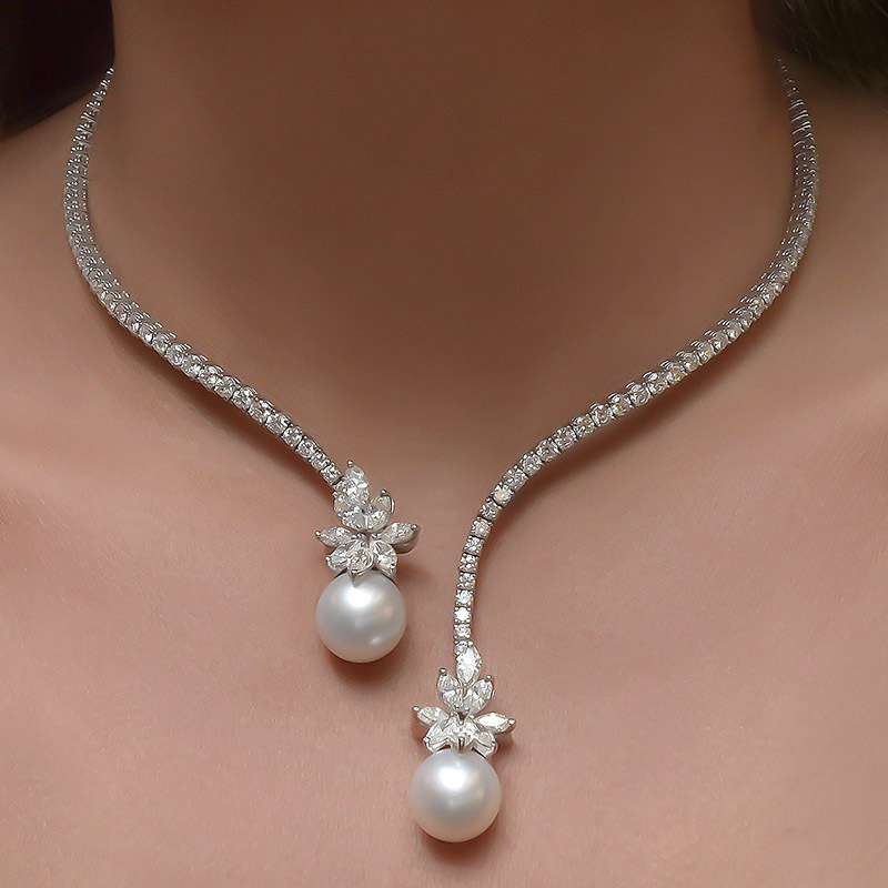 

Vintage Luxurious Pearl And Zirconia Necklace, A Stylish Bridal Accessory For A Wedding, Featuring An Open-ended Design.