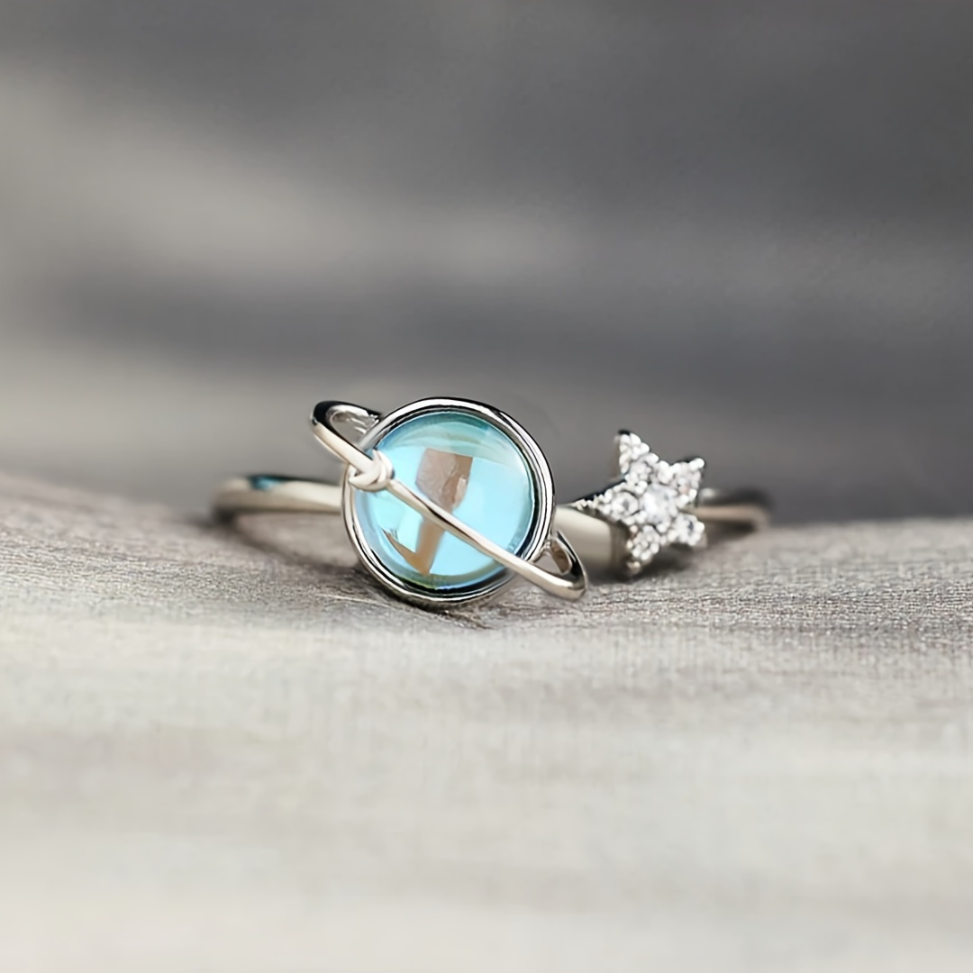 A Stylish And Unique Lady's Ring With Delicate And Creative Design Of A Small Earth And Moon Surrounded By Blue Synthetic Gemstones, Adjustable Opening Suitable For Daily Wear And Birthday Gift (without Box).