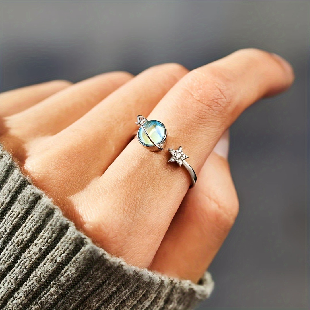 A Stylish And Unique Lady's Ring With Delicate And Creative Design Of A Small Earth And Moon Surrounded By Blue Synthetic Gemstones, Adjustable Opening Suitable For Daily Wear And Birthday Gift (without Box).