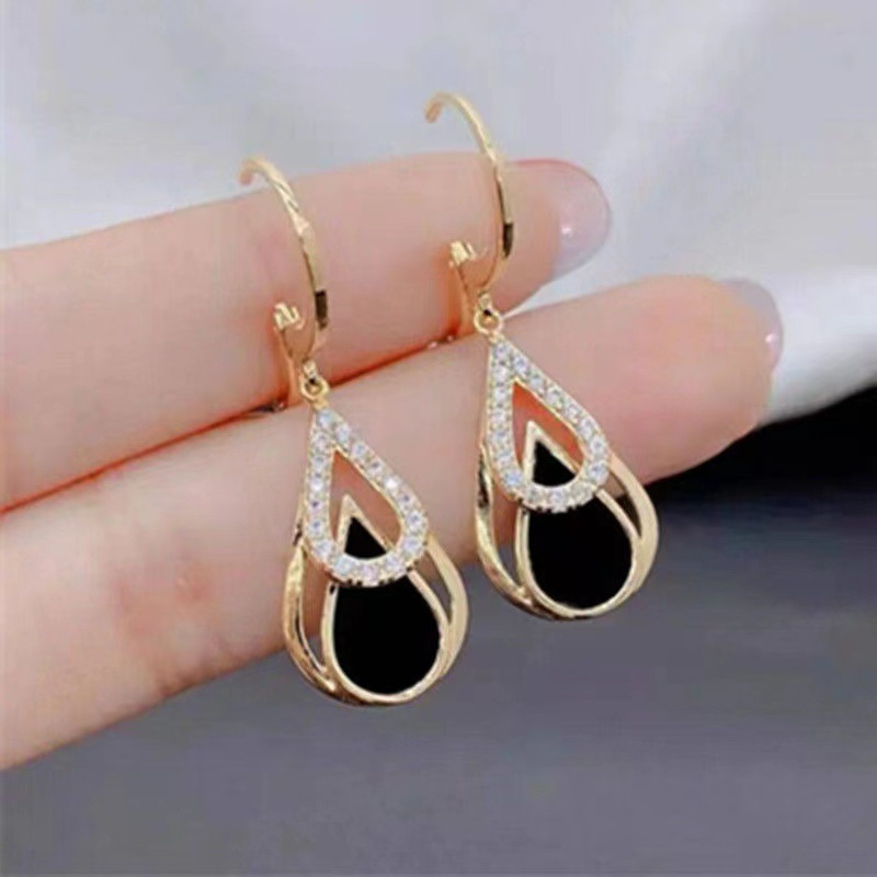 TEMU Un par de elegantes pendientes de de agua negros, hechos de acero inoxidable, diseño lindo y elegante, pendientes originales de moda para mujer,