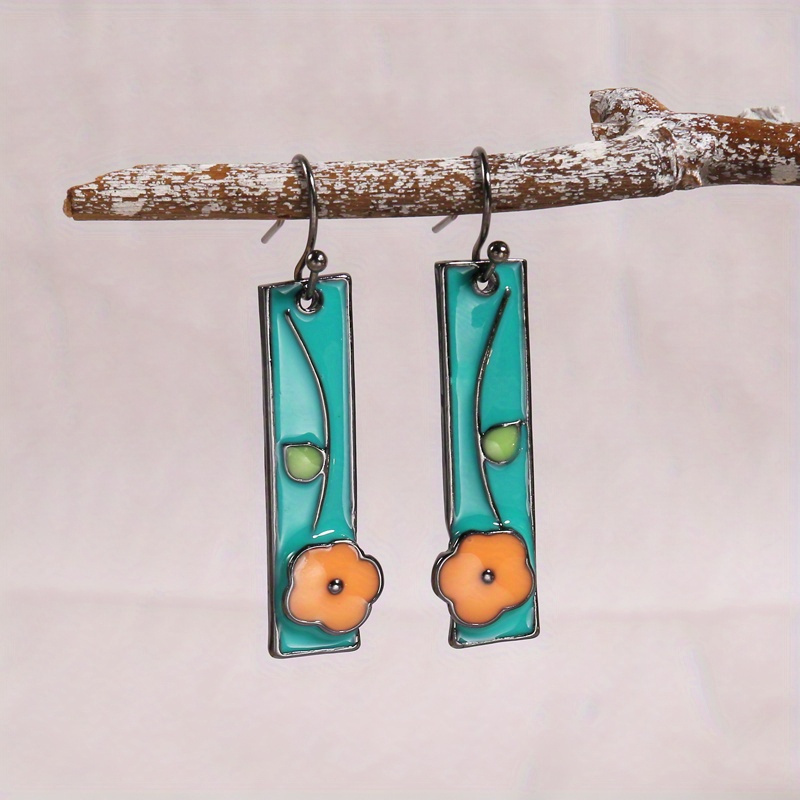 Image of Handcrafted Sky Blue Enamel Earrings, With An Orange And A Long Dangling Style, Are Ideal For Enhancing Of Attire