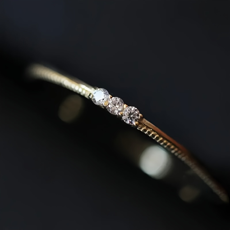 Elegant Thin Band Ring with 3 Synthetic Zirconia Stones