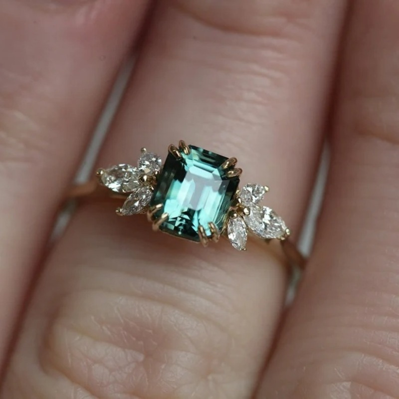 Teal Emerald Cut Zirconia Ring with Accents