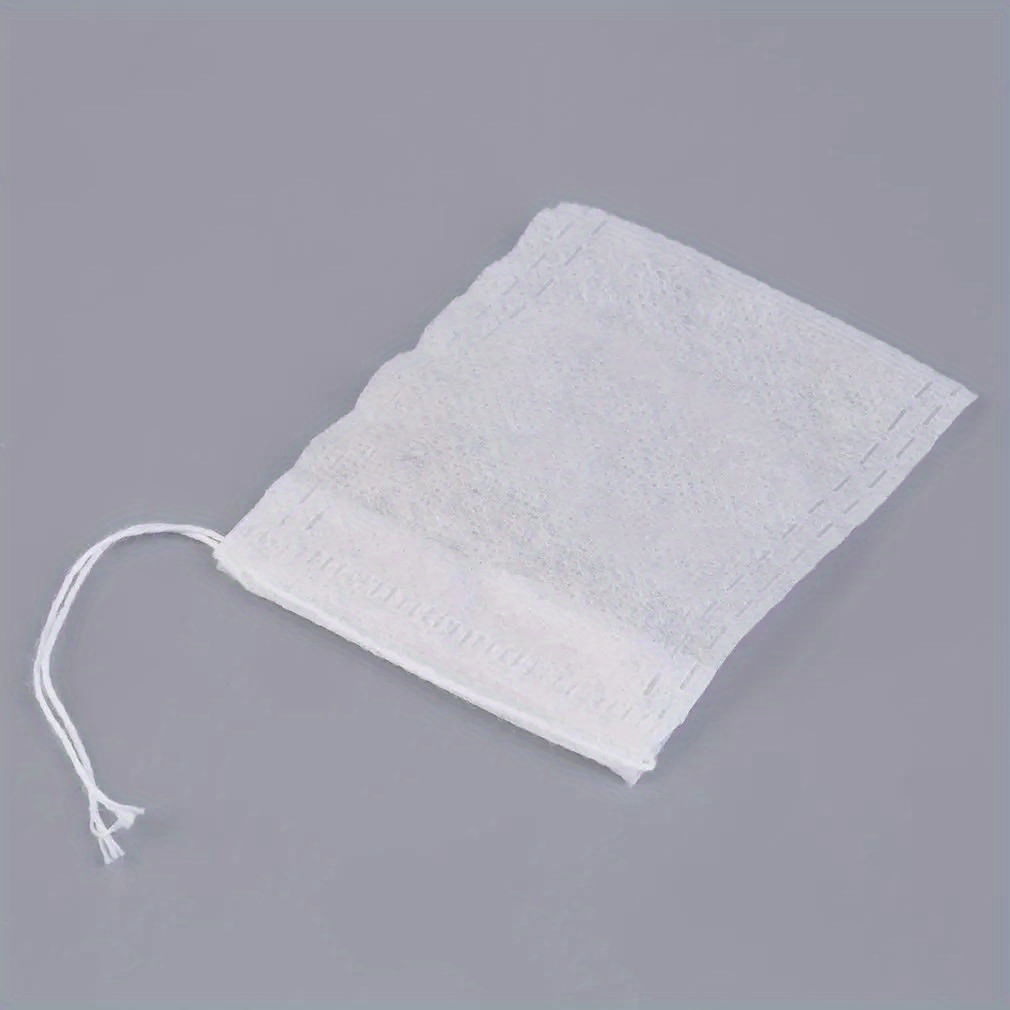 200pcs disposable tea bags empty non woven fabric tea infusers with drawstring for loose leaf tea and spice sachets details 8