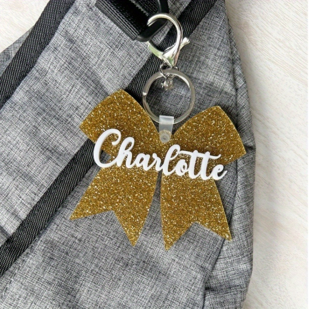 

Personalized Cheerleading Bow Keychains - Custom Acrylic Keychains With Names - Perfect For Cheerleading Moms, Coaches, And Fans - Available In White