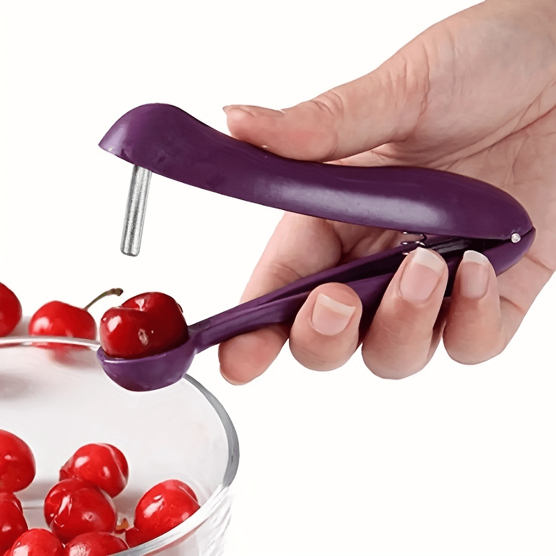 a convenient and quick plastic cherry pitter with a comfortable   for cherry recipes and olive preparation