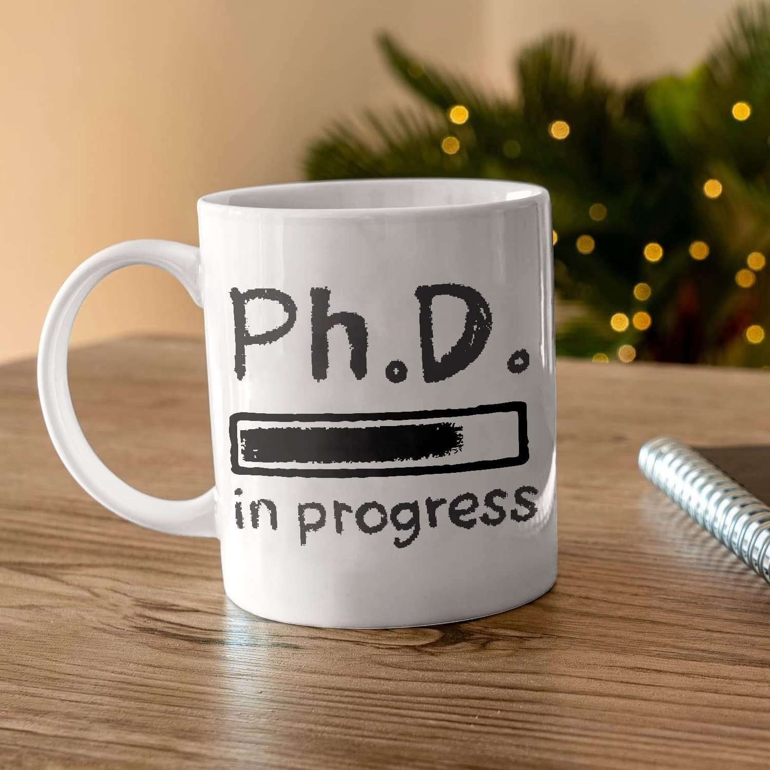 

Phd In Progress Future Medical Doctorate Student Graduation From Teacher Mom Dad Uncle Aunt Grandpa Grandma Graduates White 11oz Or 15oz Ceramic Mug