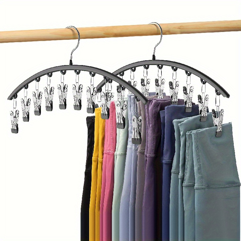 A Metal Hanger With A Polished Surface, Space- Closet Organizer With 10 Clips - Versatile Curved Hanger For Pants, Socks, Leggings - Durable Home And Hanger