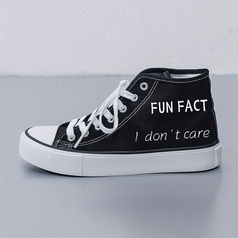 Black and white women's sneakers sold by 100 Spartans