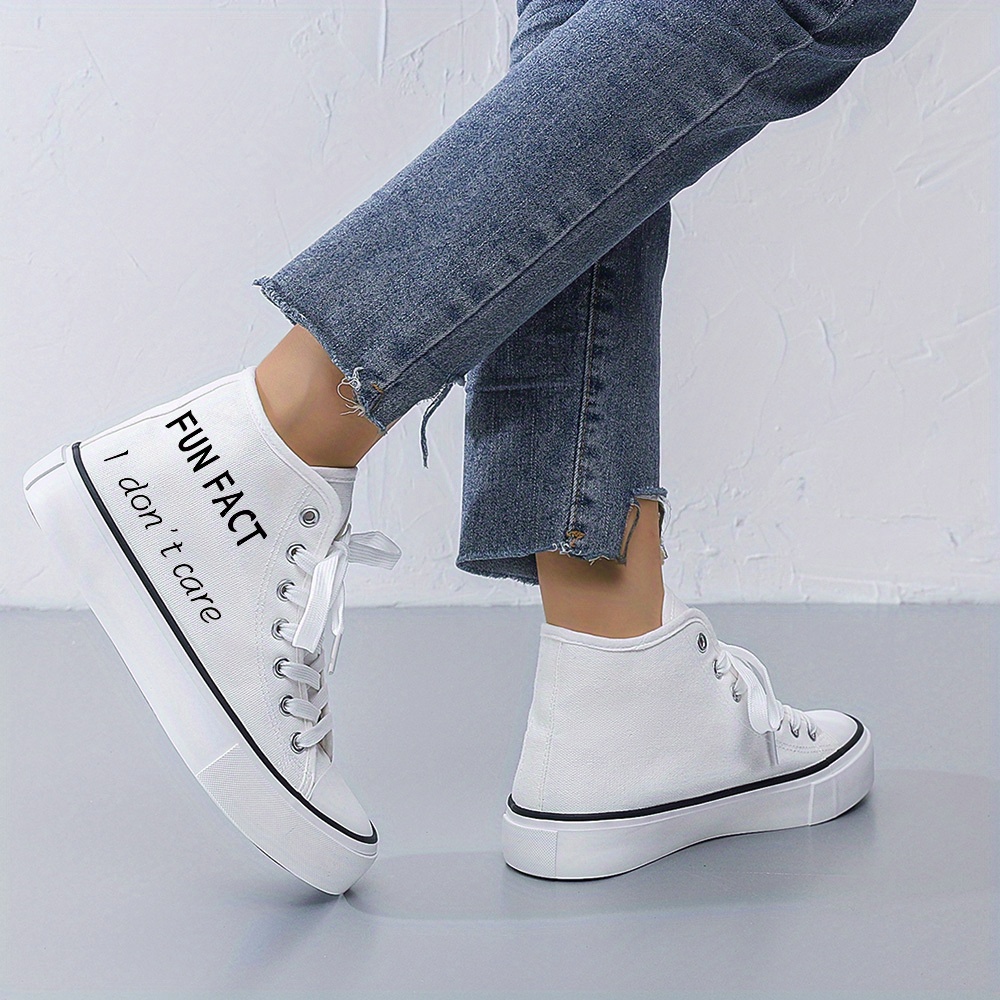 Black and white women's sneakers sold by 100 Spartans