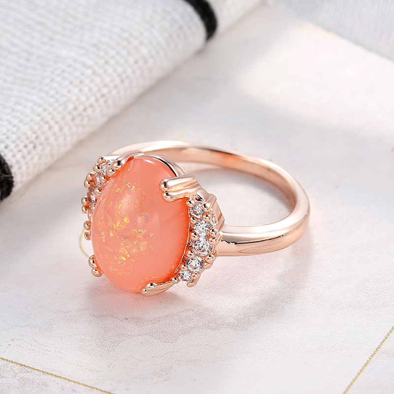 

- New Opal Ring Hot Sale In Europe And America Goose Egg Orange Opal Ring Women's Creative Copper Inlaid Zircon Jewelry