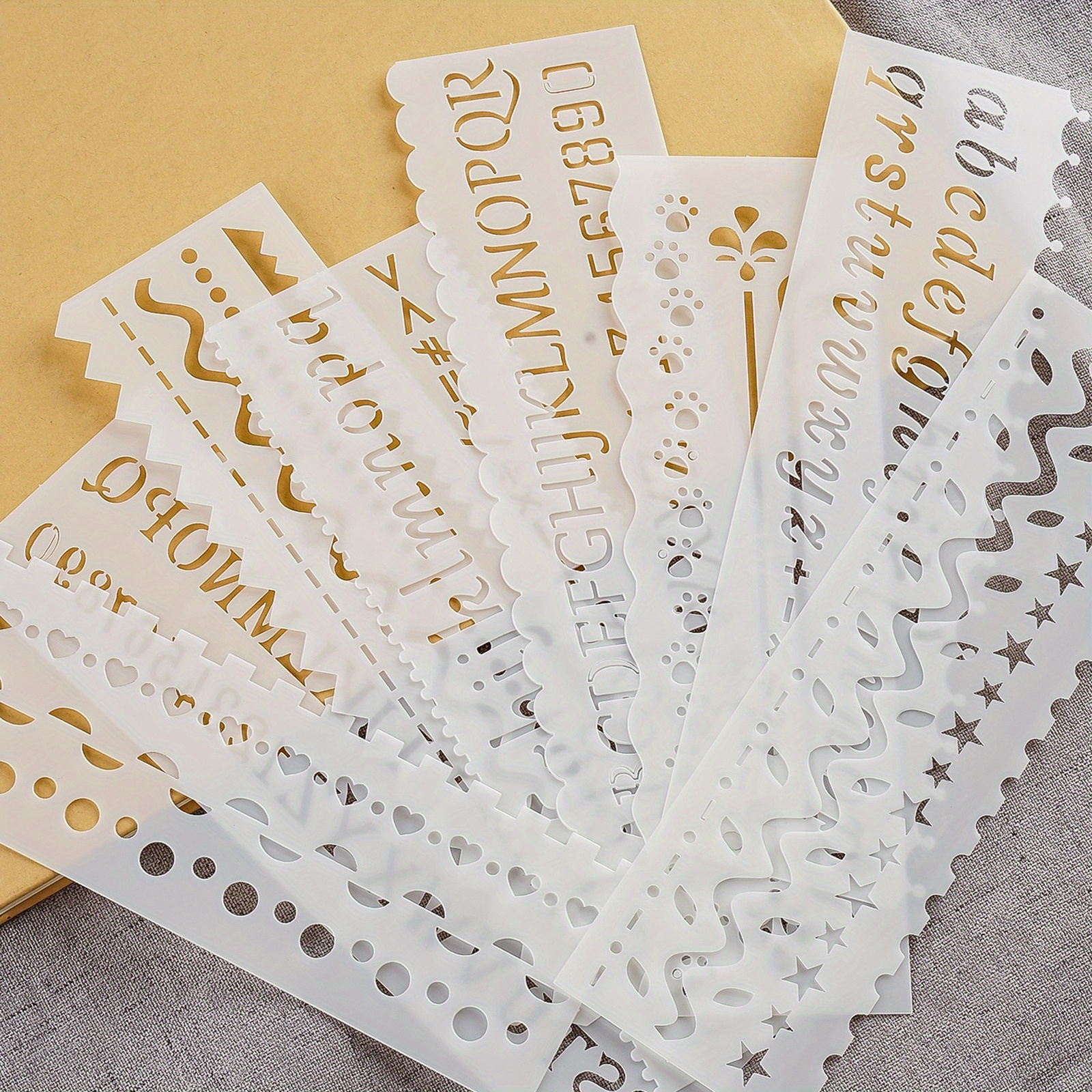 A Set Of Reusable Pet Letter Painting Stencils With Hollow Lace Rulers, Ideal For Diy Journaling, Leaf, Car, Weather, And Animal Designs - Perfect For Artists And Crafters