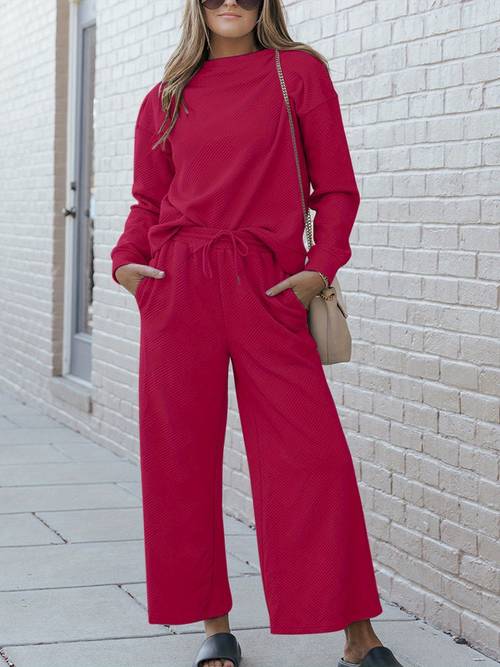 womens two piece set casual lounge set relaxed fit two piece outfit black soft knit fabric long sleeves pullover style relaxed neckline hip length top wide leg pants with pockets drawstring waist solid color comfortable and cozy