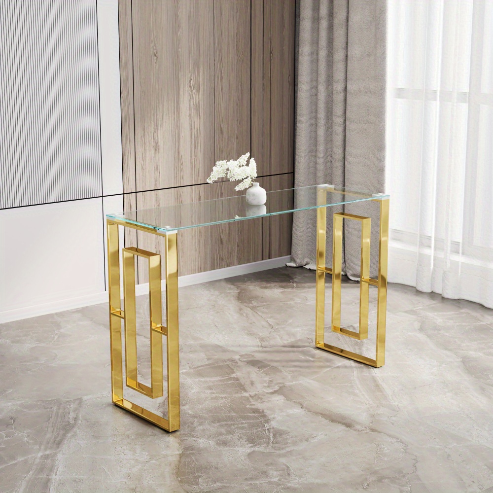 A Modern Style Table With A 47-inch Glass Console Table, A Transparent Glass Narrow Entry Table, And An Entry Table With A Geometric Stainless Steel Frame In The Living Room.