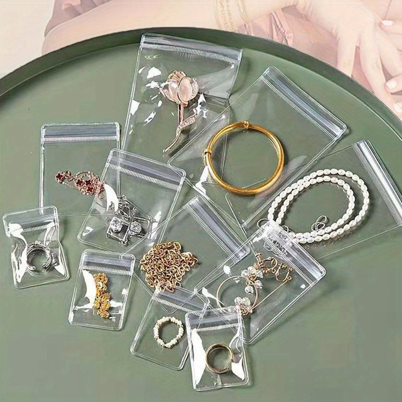 acrylic jewelry organizer box with 60 anti tarnish portable bags clear transparent storage case with compartments contemporary multipurpose floor mounted plastic box for earrings rings necklaces bracelets no electricity needed Product details 2