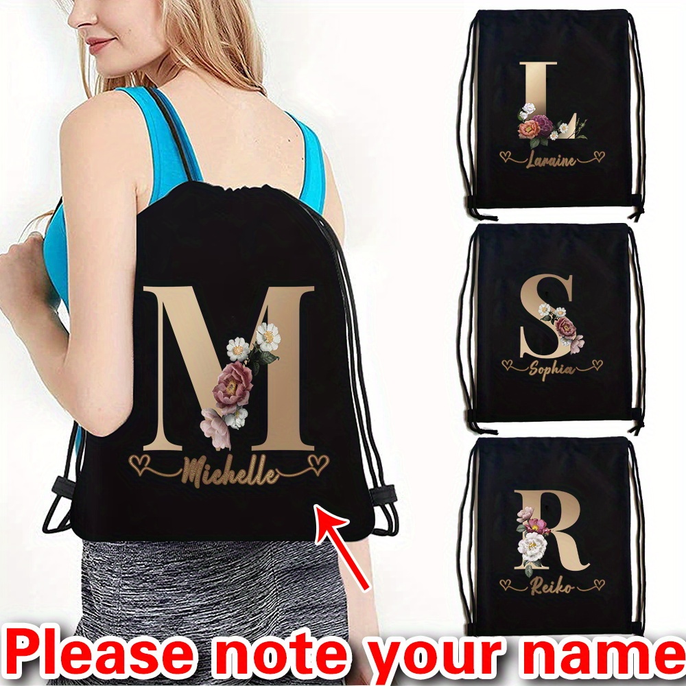 

Customizable Black Canvas Drawstring Backpack With Floral Initial Design - Sports Gym Bag, Travel & Hiking Pack With Shoe Compartment, A-z Letter Options, Travel Backpack