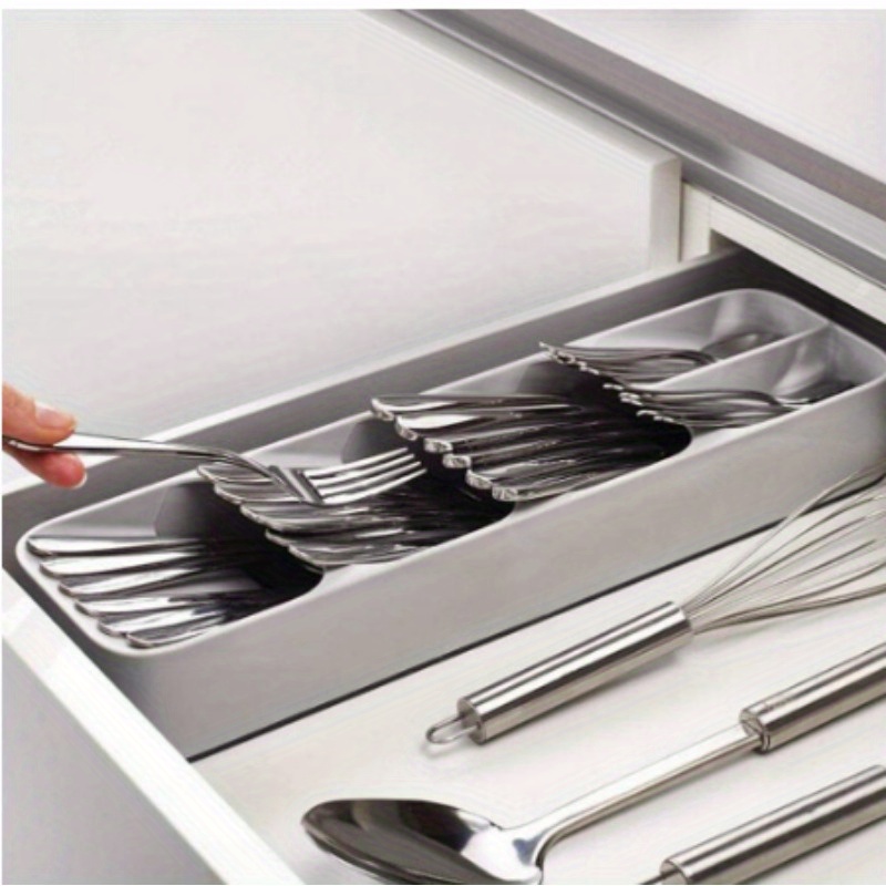 

Storage Organizer For Cutlery, Including Knife, Fork, Spoon, Seasoning Bottles, And Drawer Compartments.