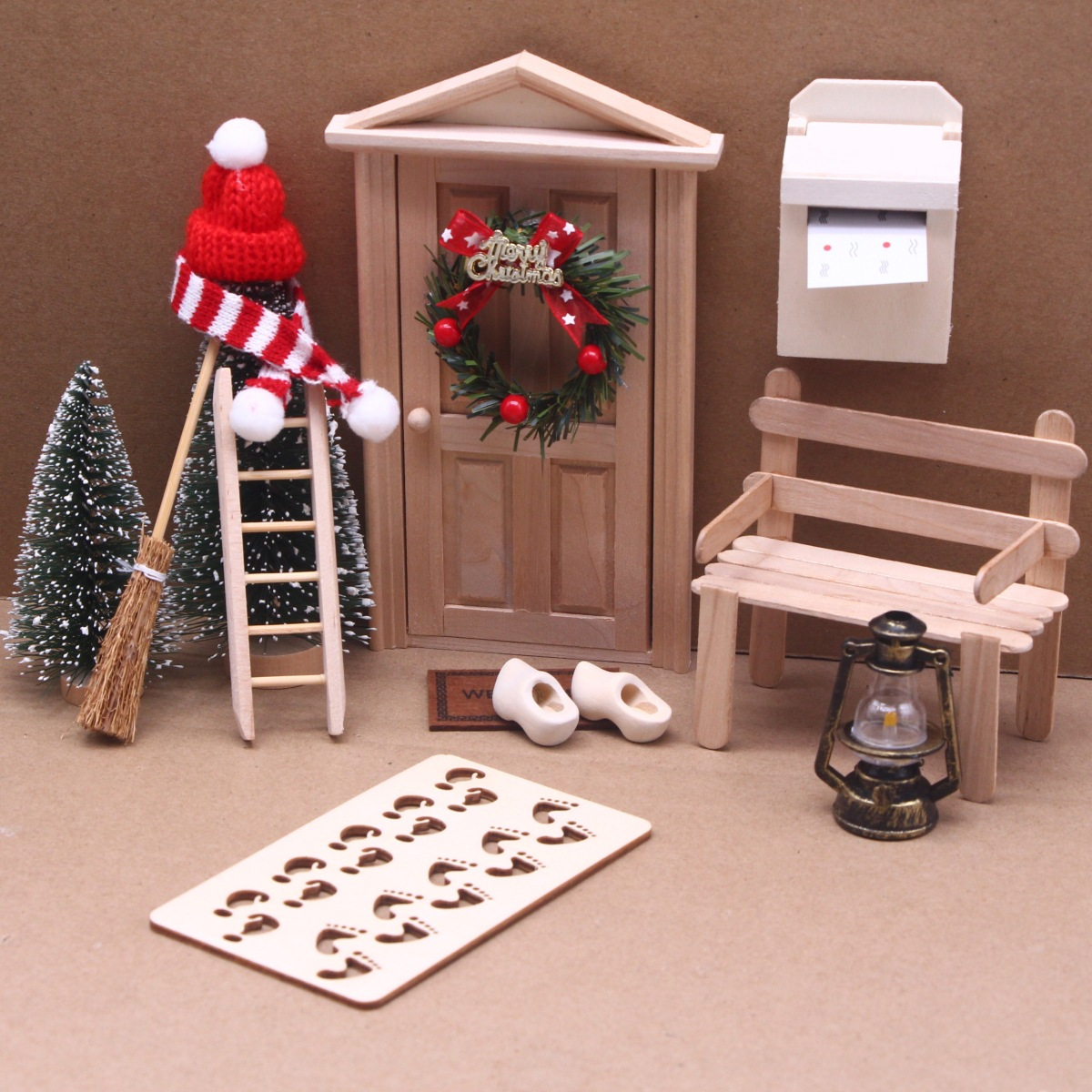 Small Christmas Decorations For A Dollhouse, Including A Red Hat And Scarf, A Wreath, A Tiny Tree, An Oil Lamp, A Mailbox, A Bench, And Additions For A Fairy Playhouse
