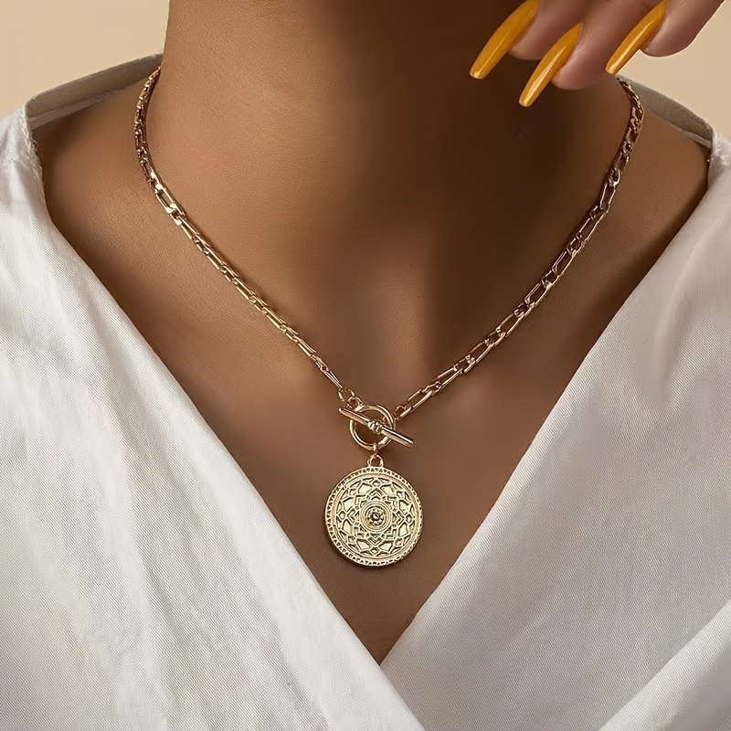 

A Round Pendant Necklace For Ladies With A Heavy And Thick Ot , A Collarbone In Golden Color.