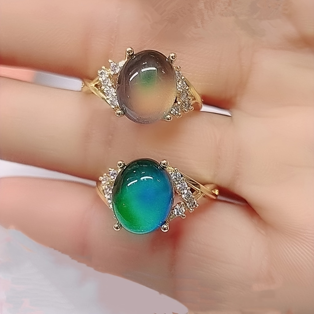 

An Elegant Alloy Mood Ring With A Design And Temperature-sensitive Color-changing Gemstone Without Plating - A Versatile Fashion Accessory For Everyday Wear