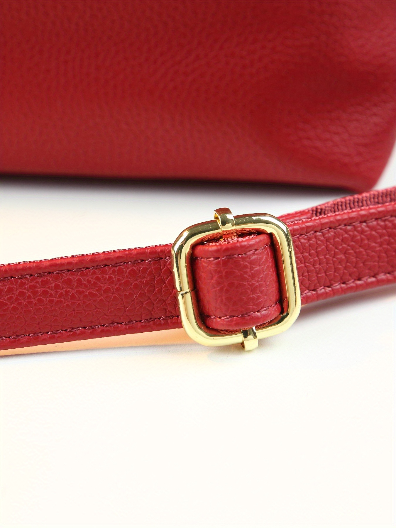 Bucket tote held by hand