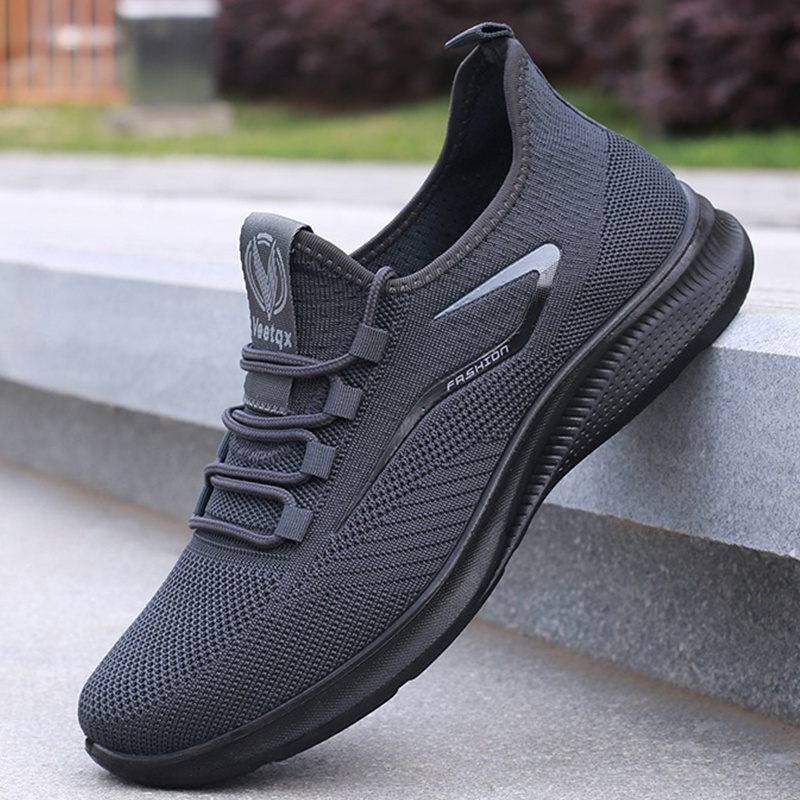 mens everyday sneakers   breathable fabric lightweight md sole and a low top lace up style for year round   black featuring white branding and text versatile footwear contemporary casual footwear   fabric sneakers Product details 1