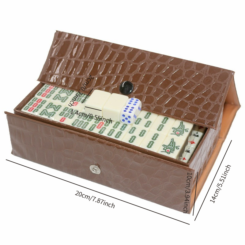 a   compact travel mahjong set featuring the chinese version of mahjong with 144 tiles plus 2 spare tiles and 2 dice measuring 20 14 10mm