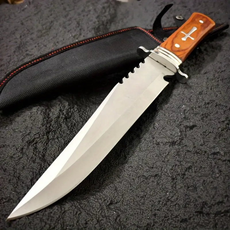 inch outdoor straight knife with a 7 4 inch blade length serrated design wooden handle with metal decoration with a black knife sheath a practical tool for the outdoors and a mens knife Product details 8