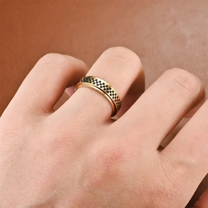 a stylish new mens ring with a unique european and american design featuring a resistant oil coated rotatable small checkered mosaic pattern its a versatile accessory durable and suitable for everyday wear or as a gift Product details 1