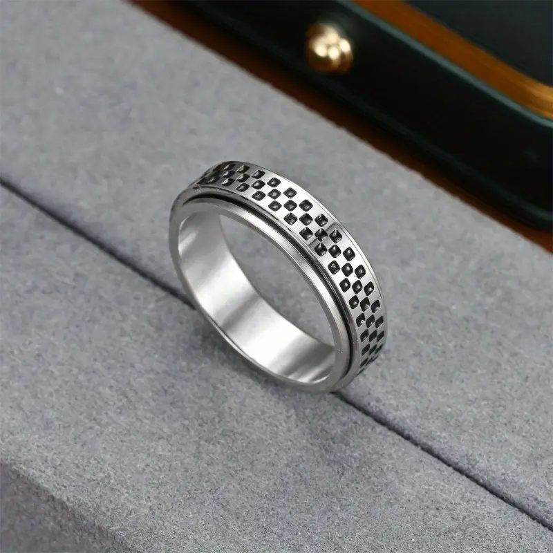 a stylish new mens ring with a unique european and american design featuring a resistant oil coated rotatable small checkered mosaic pattern its a versatile accessory durable and suitable for everyday wear or as a gift Product details 3